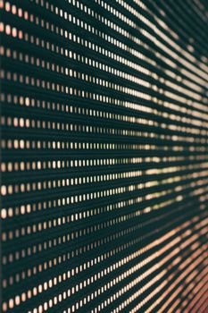 Abstract image featuring a close-up of an LED panel with glowing light patterns.